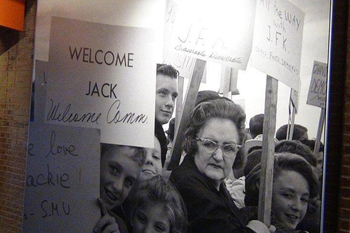 a group of people holding signs in a protest