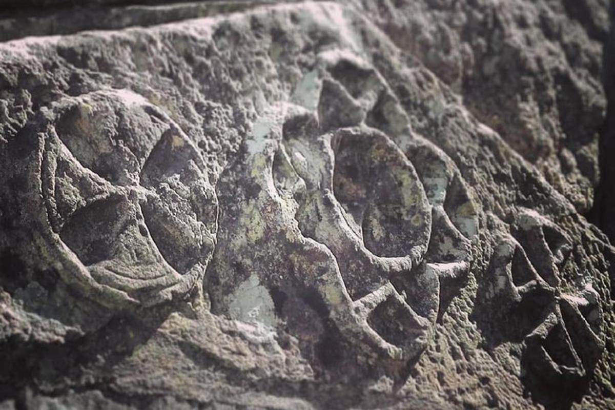 a stone relief of a man and a woman