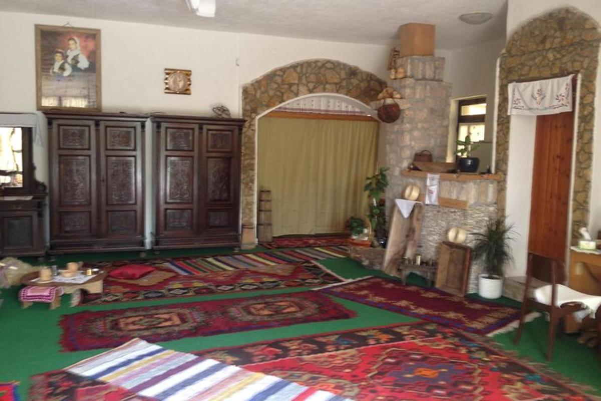 a living room with a large rug in a room