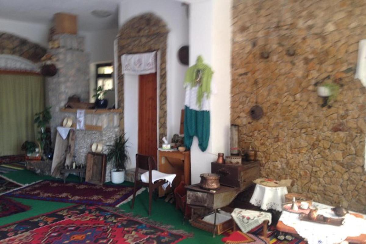 a living room with a stone wall