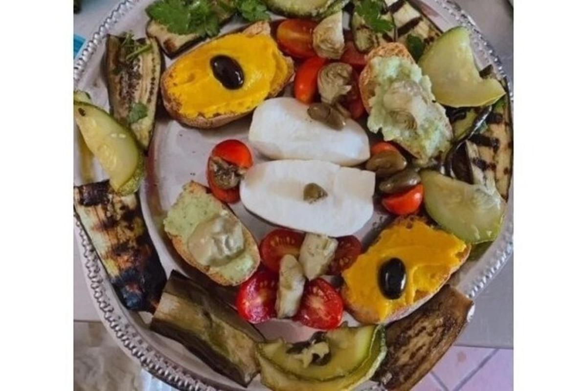 a plate of food with fruit and vegetables on it