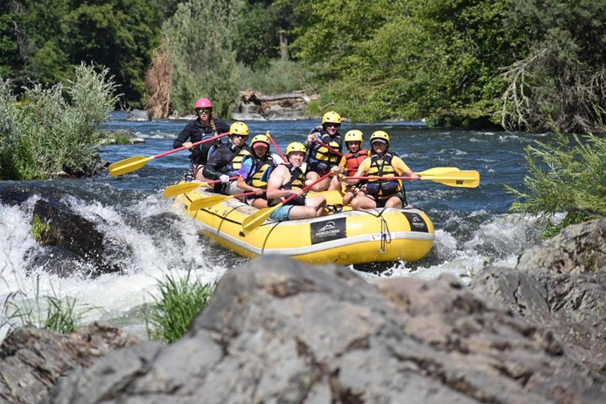 a group of people in a raft on a river