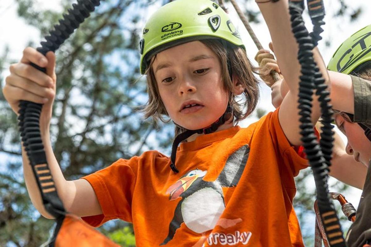 a young child is riding on a rope swing