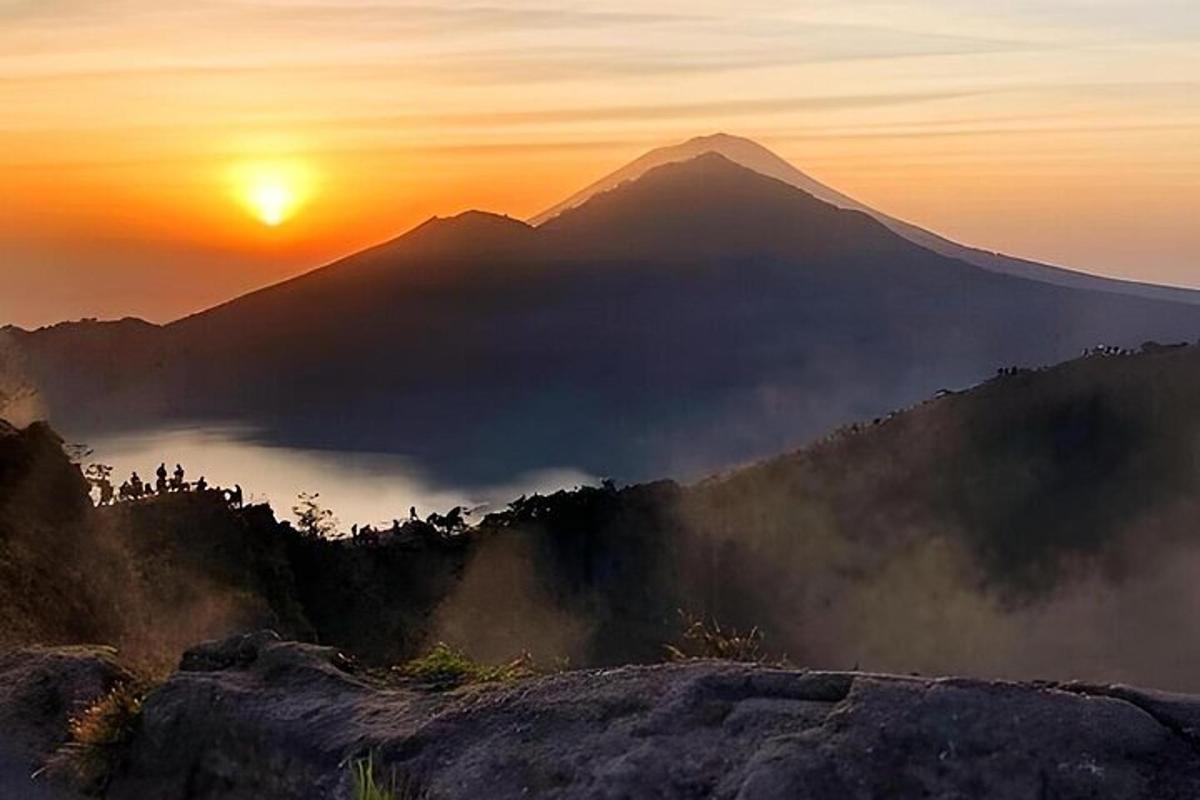 a view of a mountain at sunset