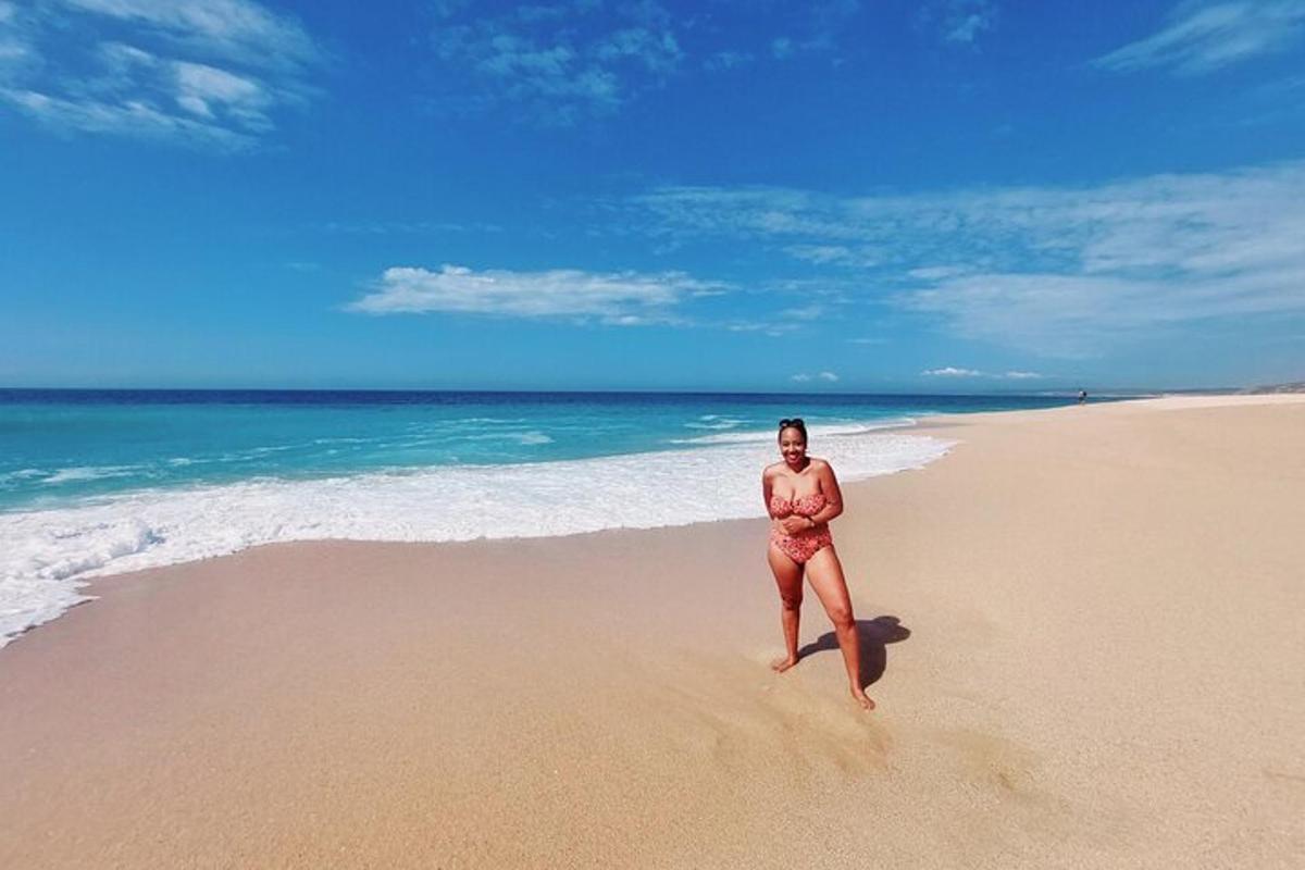 a woman in a bikini standing on a beach