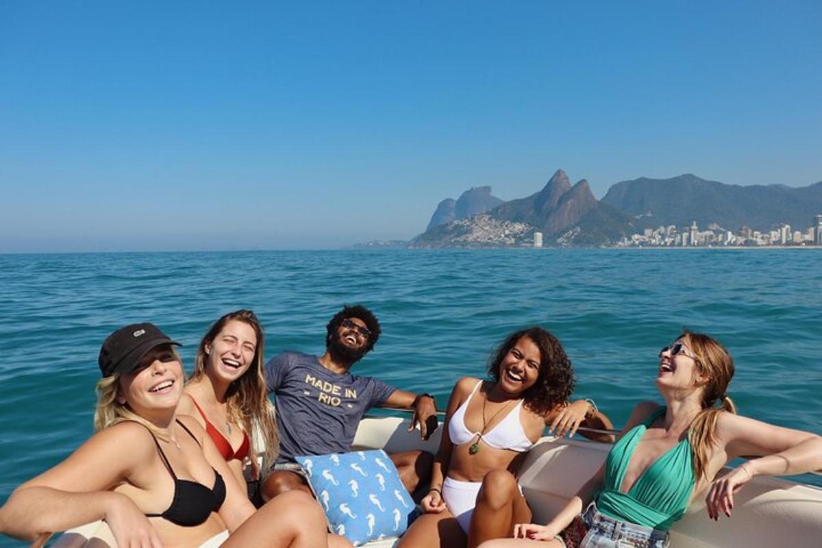 a group of people sitting in a boat on the water
