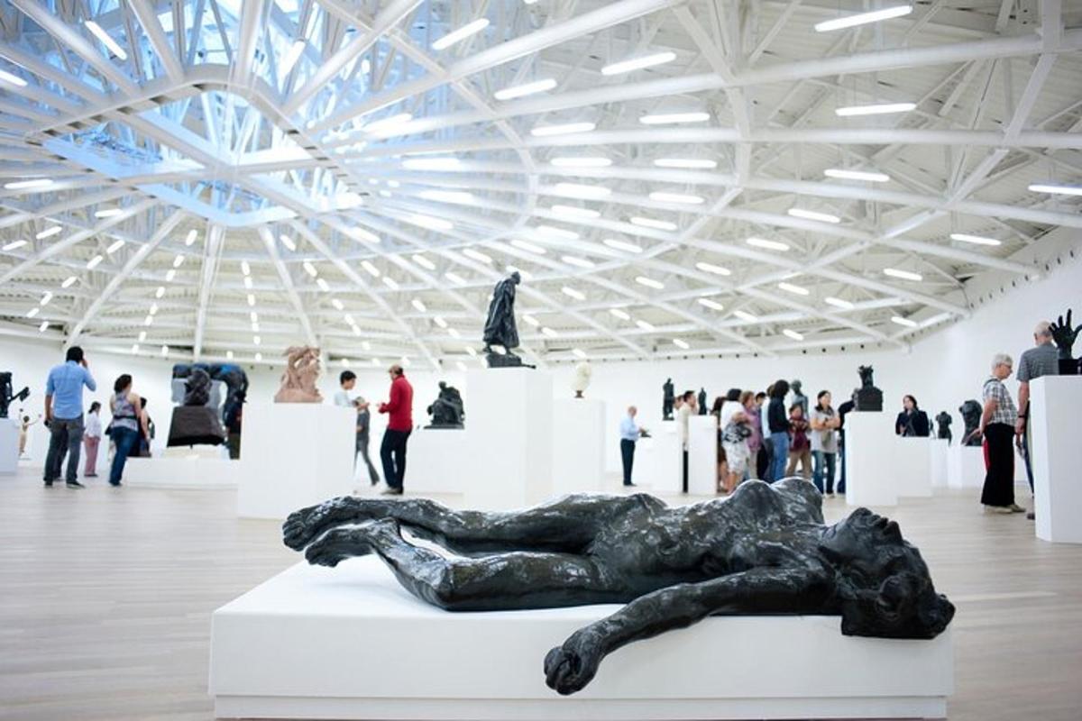 a sculpture of a woman laying on a table in a museum