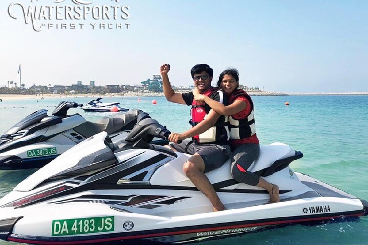two people riding on a jet ski in the water