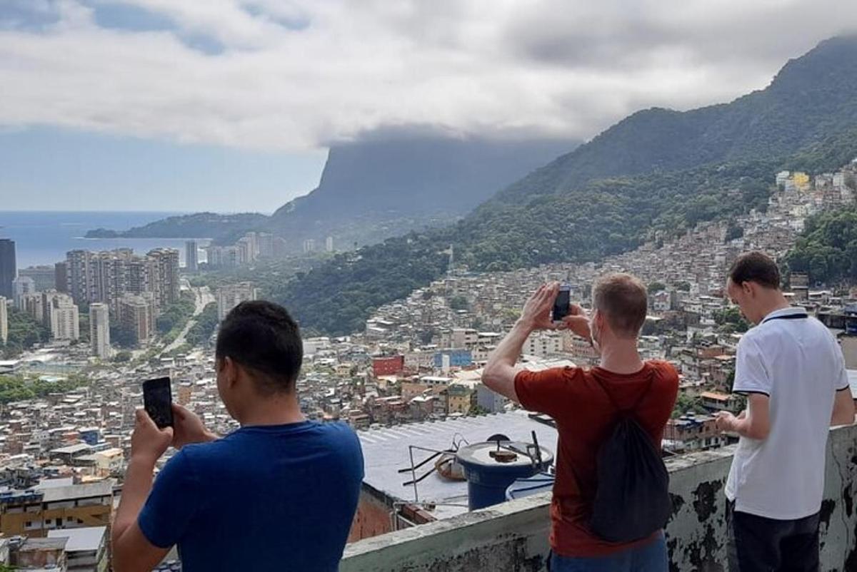 a group of men taking pictures of a city