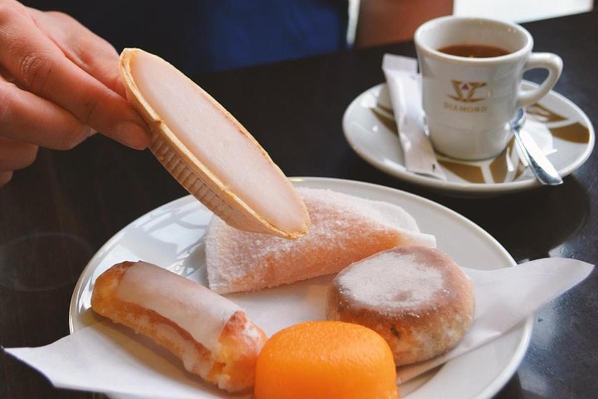 a plate of food with a banana and donuts and a cup of coffee