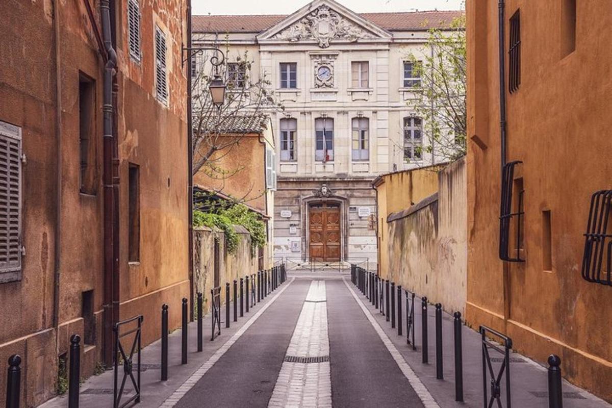an alley with a large door in a building