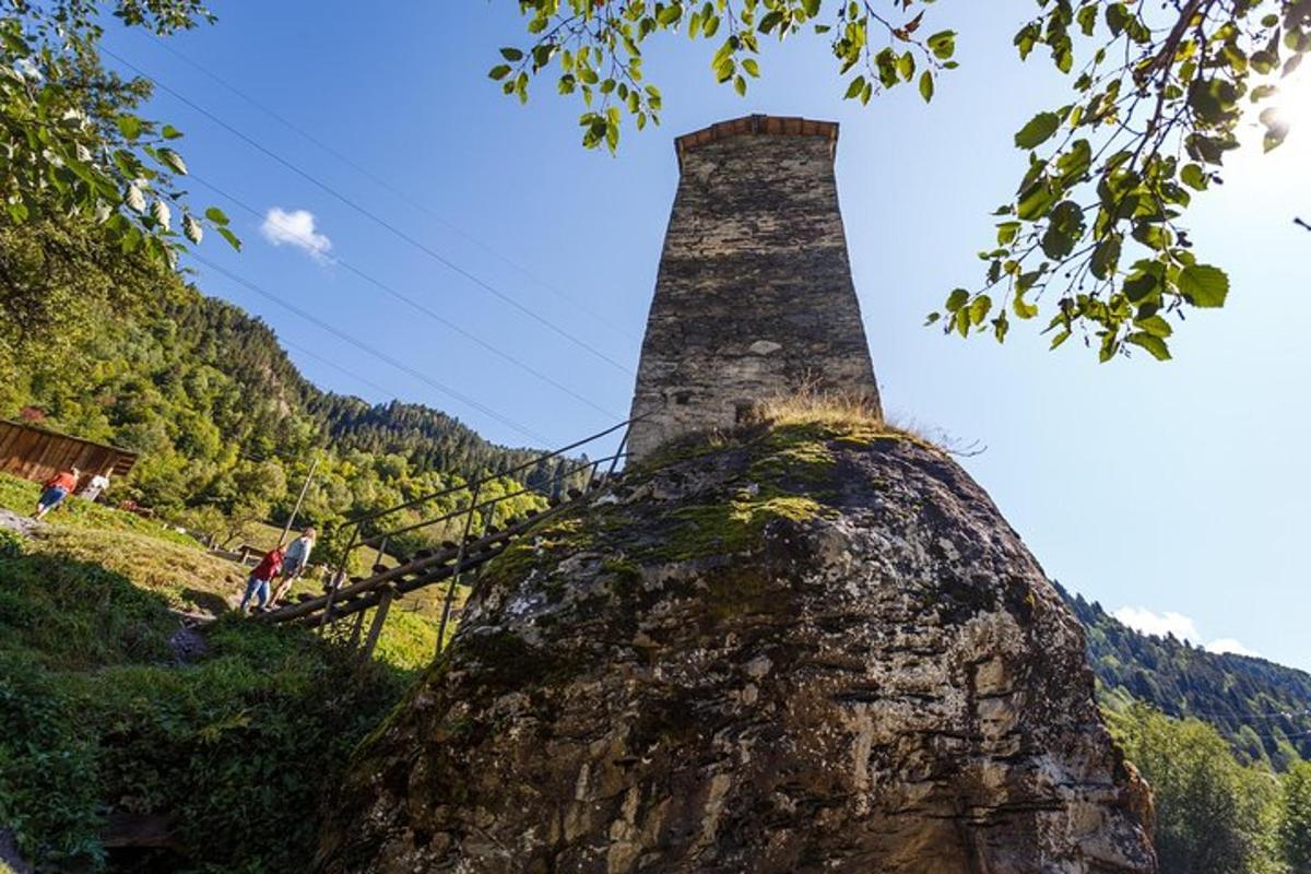 a stone tower on top of a mountain
