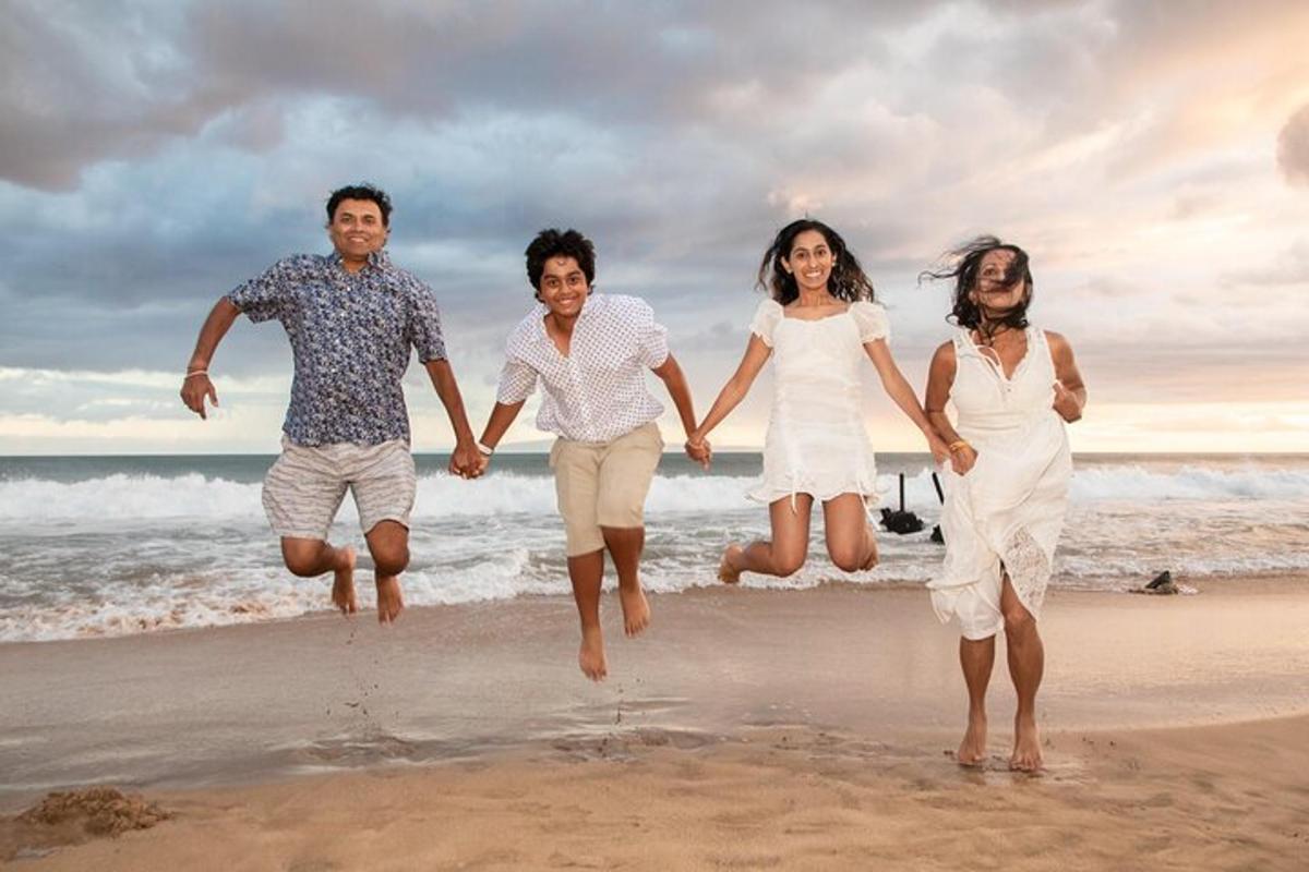a group of people running on the beach