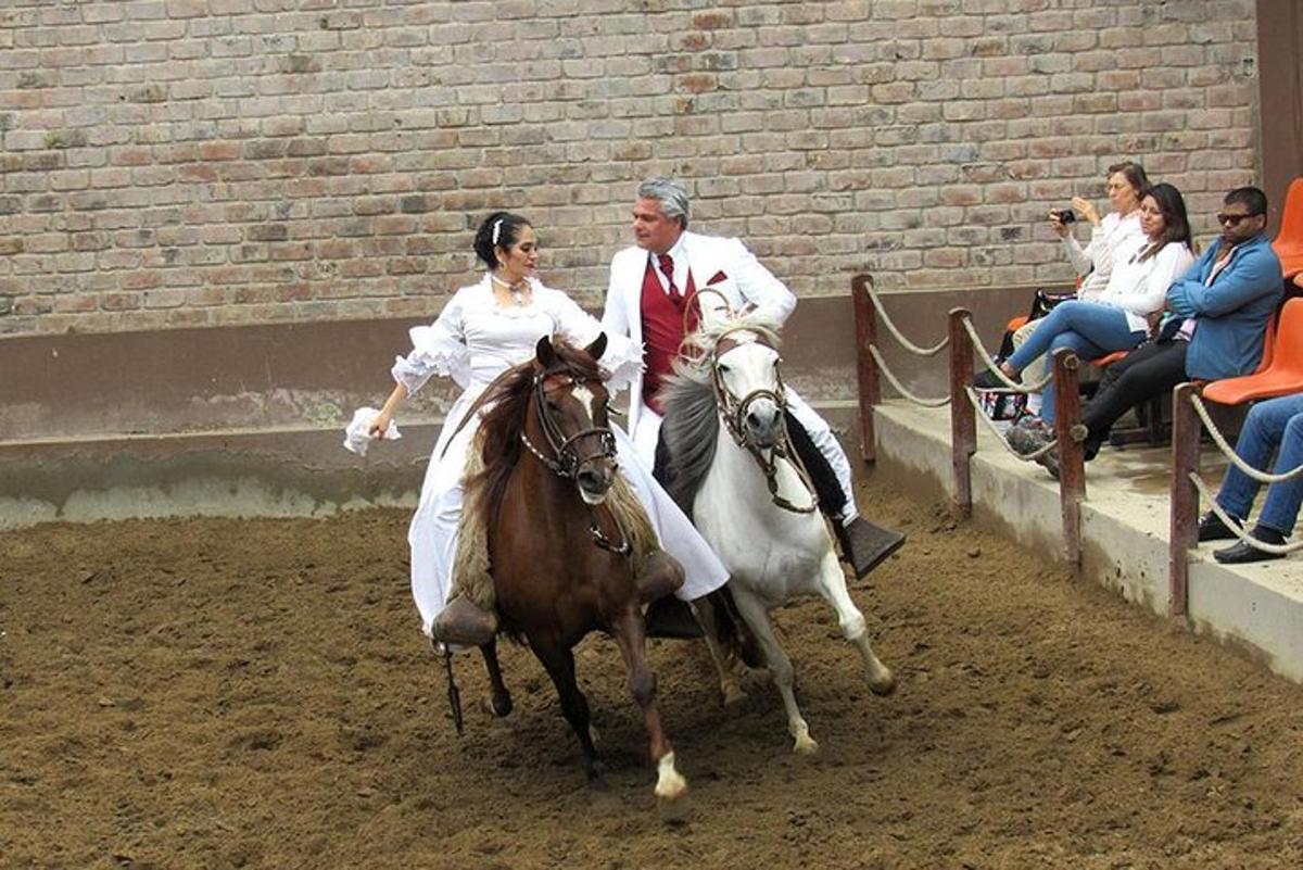 a man and a woman riding on a horse