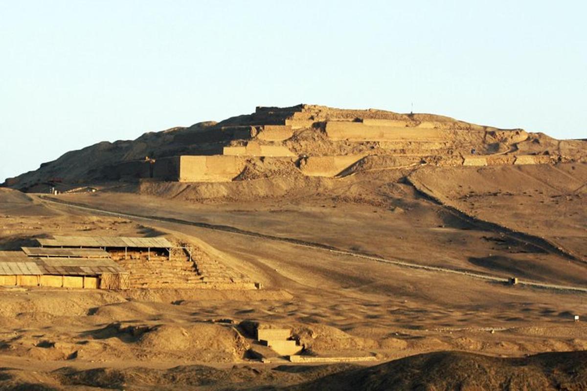 a dirt hill with a building on top of it