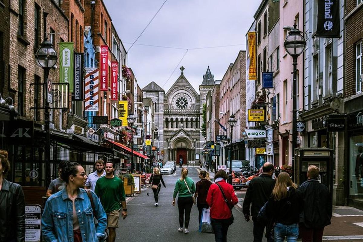 a group of people walking down a busy city street