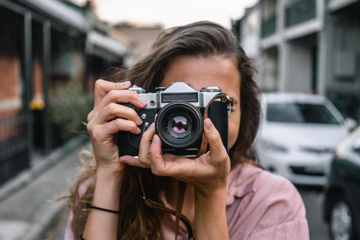 a woman taking a picture with a camera