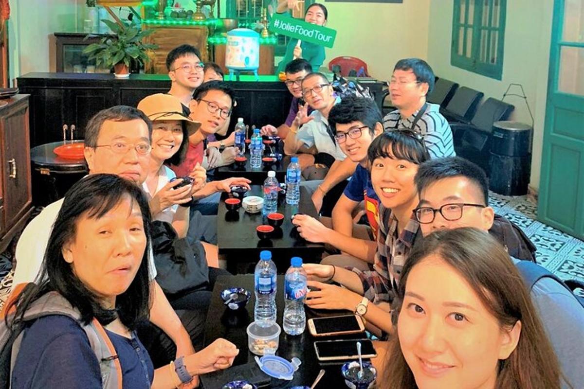 a group of people sitting around a table