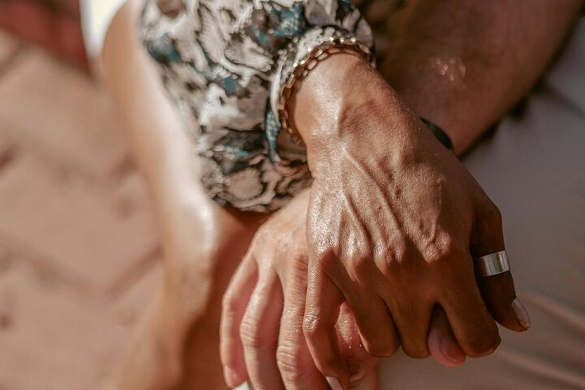 a close up of two hands holding each other