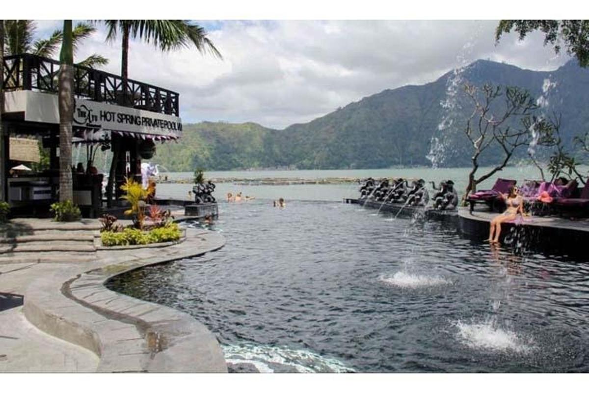 a swimming pool next to a body of water