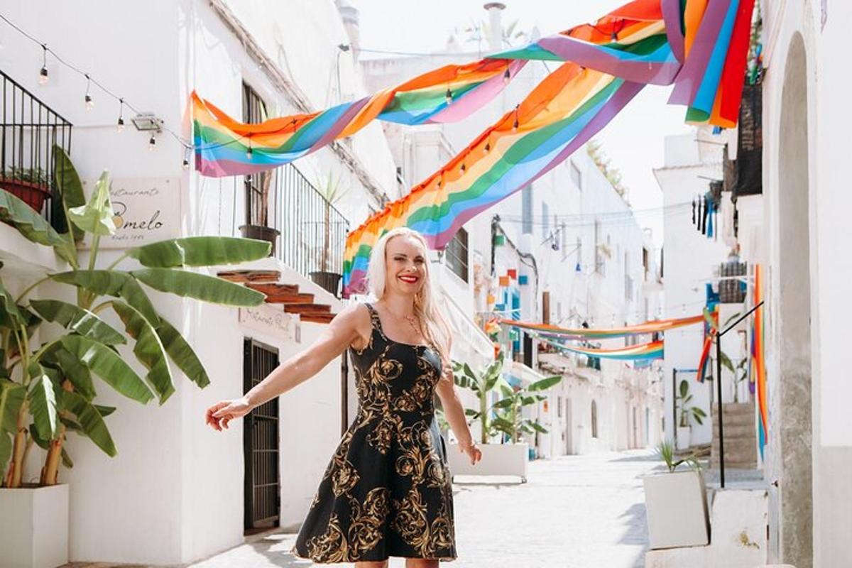 a woman in a dress walking down a street with flags
