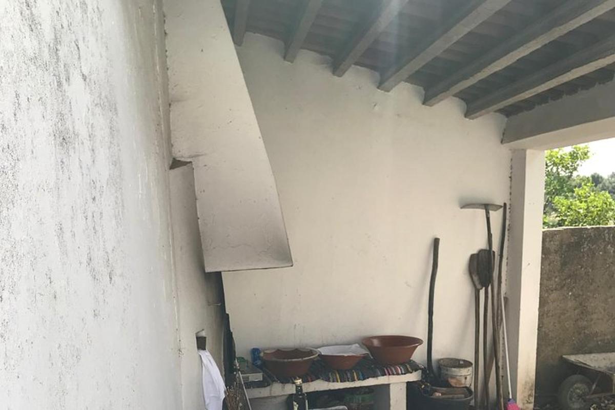 a kitchen with pots and pans on a wall