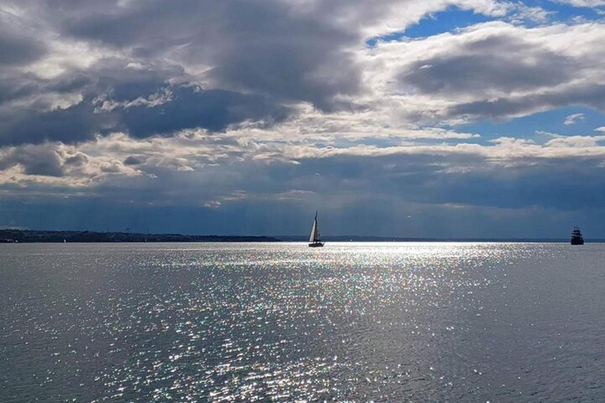 a sail boat on a large body of water