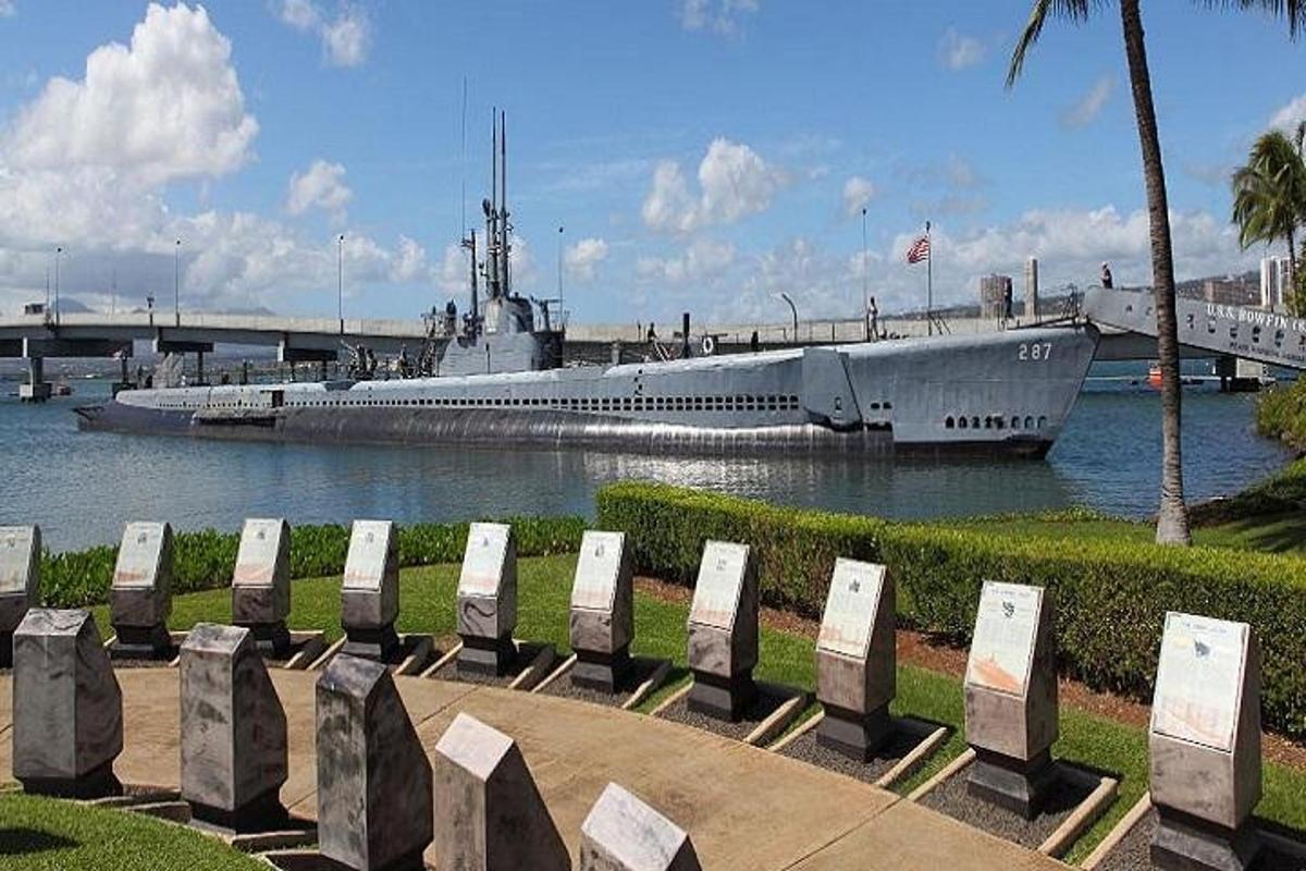 a large boat is docked in the water next to benches