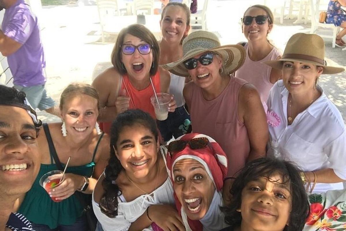 a group of women are posing for a picture