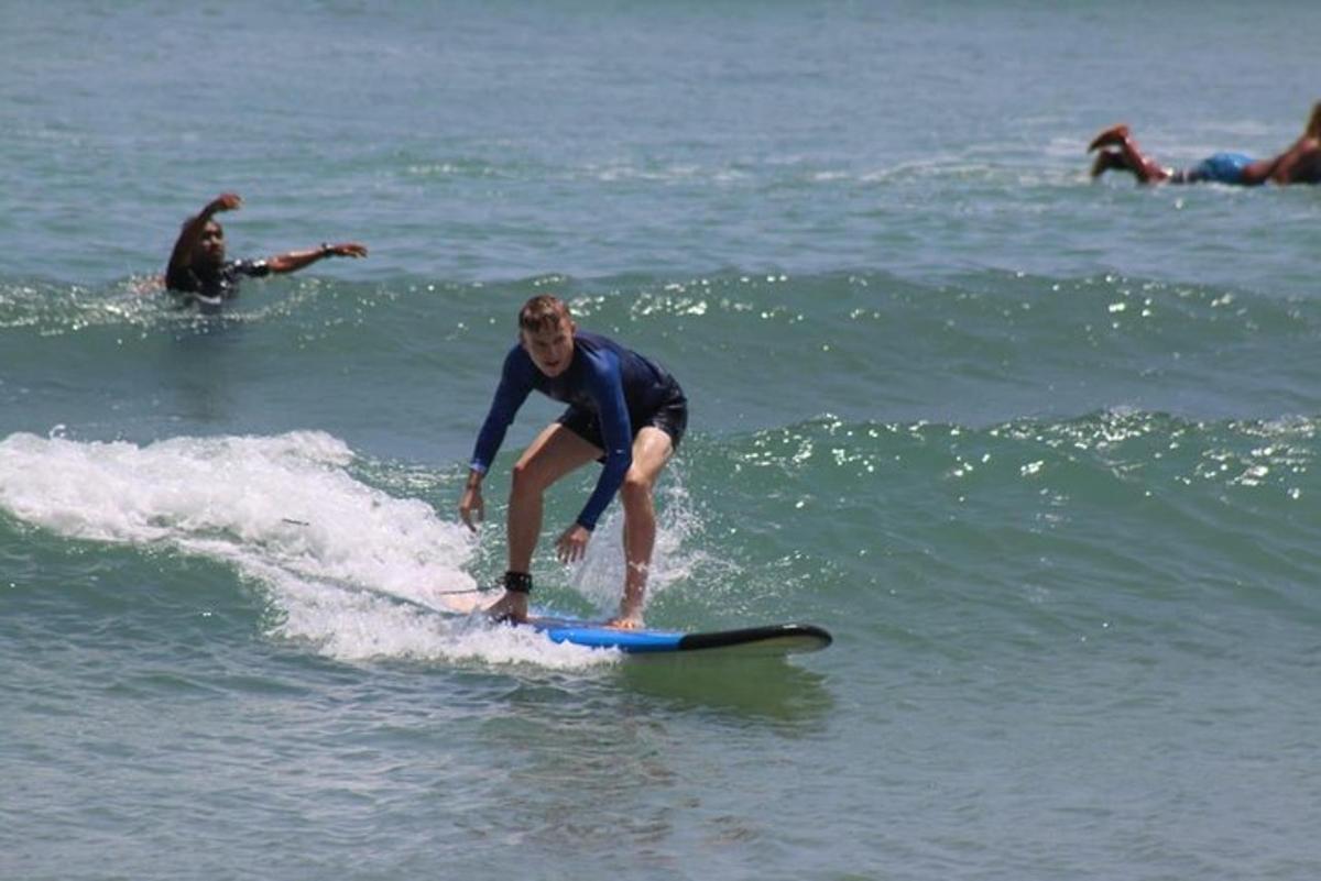 a man riding a wave on a surfboard in the ocean