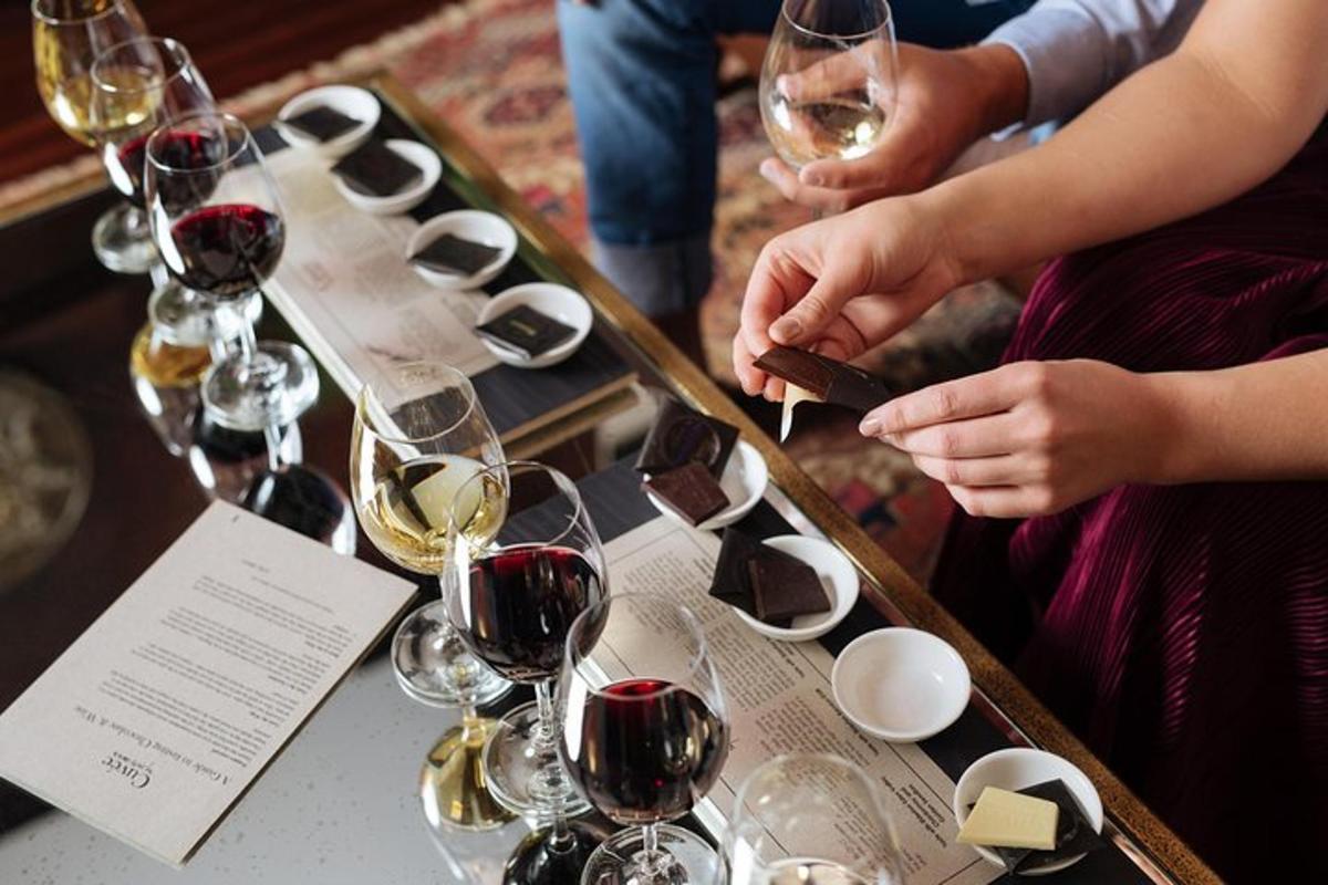 a group of people sitting at a table with wine glasses