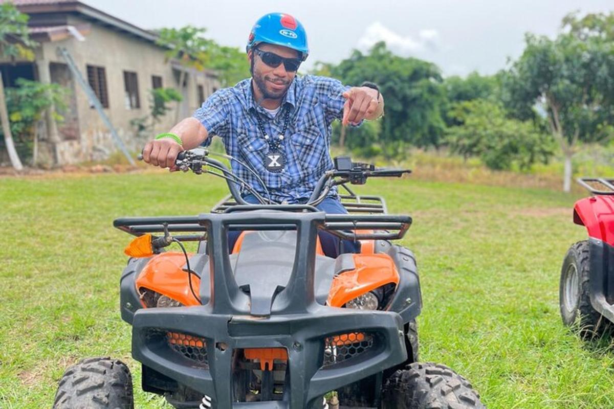 a man on a four wheeler in a field