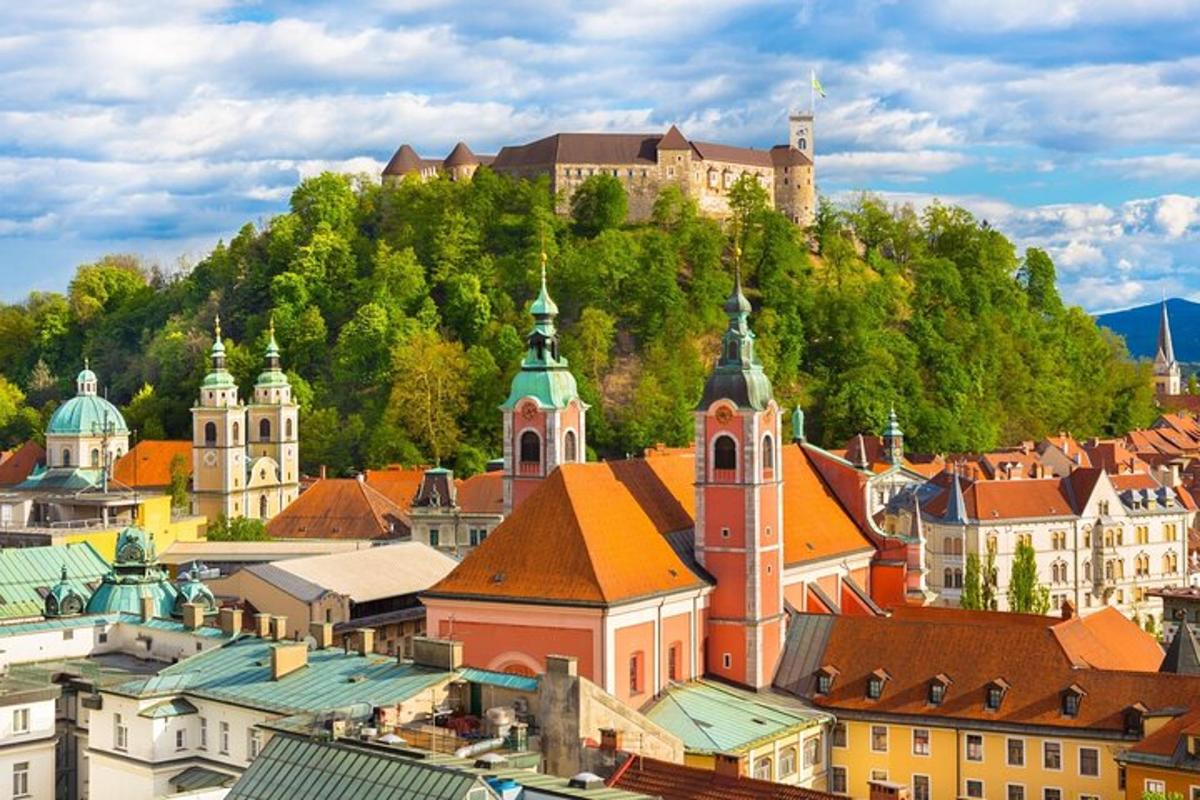 a city with a castle on top of a hill