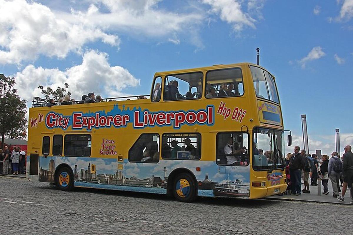 a yellow double decker bus on a street