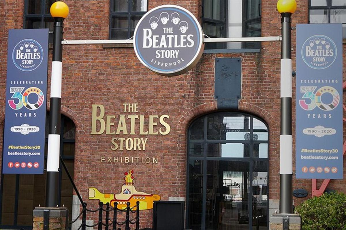 a brick building with a sign for the beatles shop