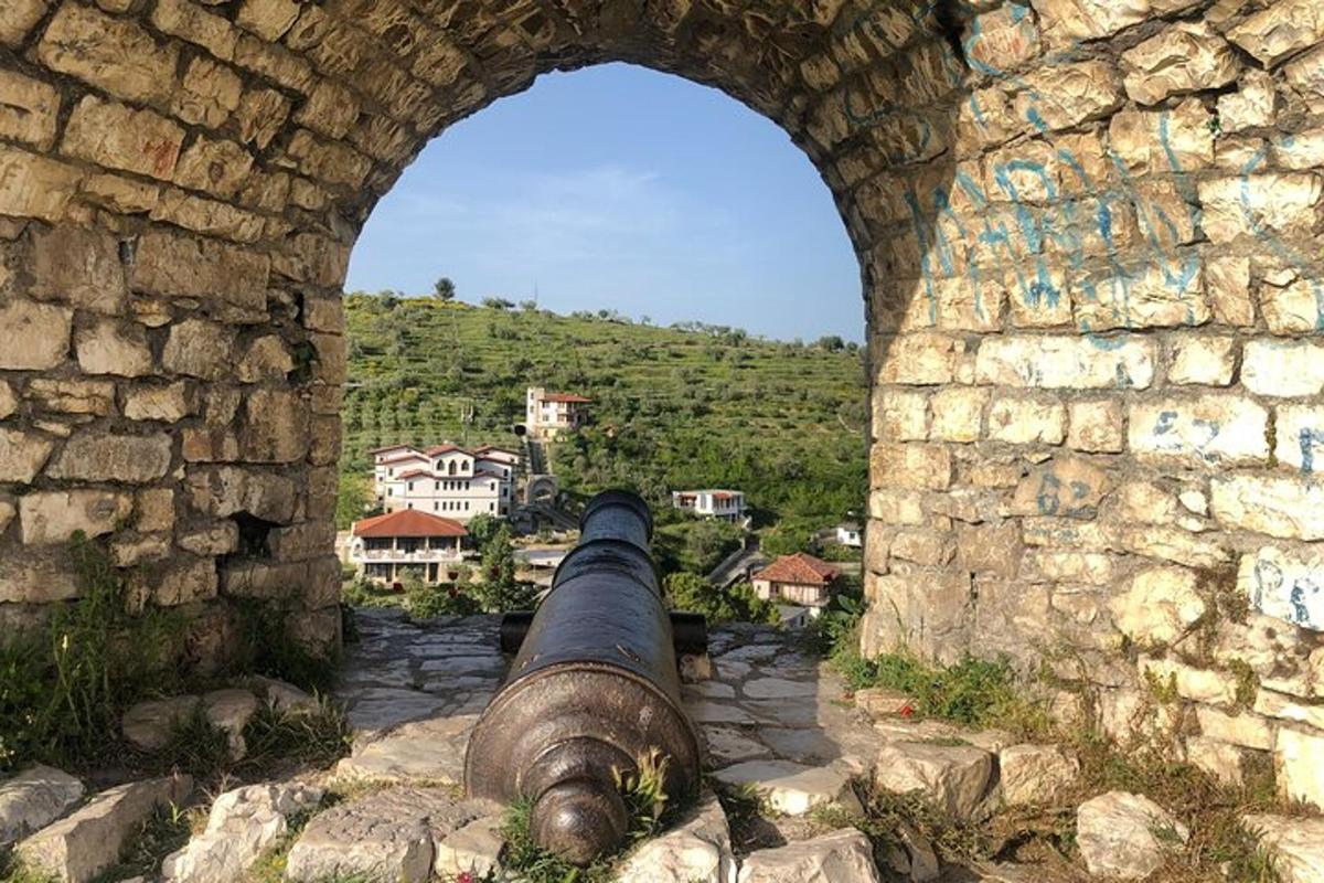 a view of a cannon from a stone wall