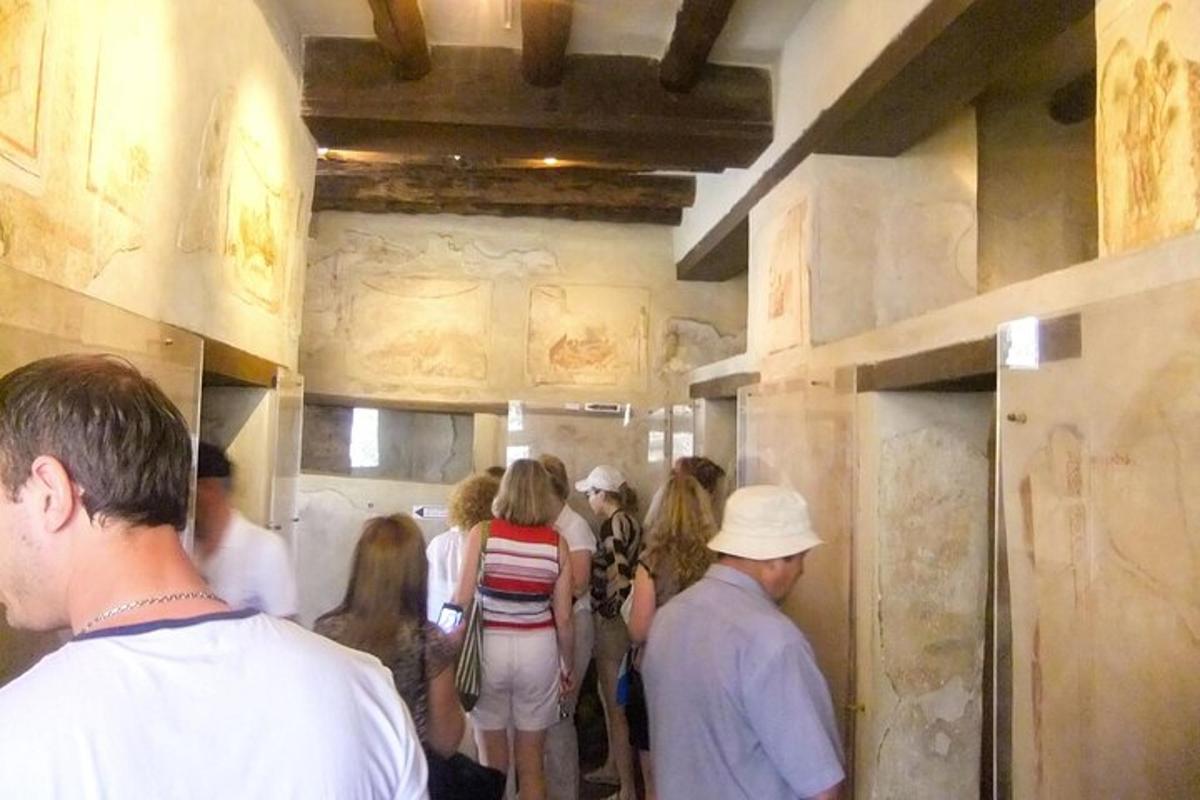 a group of people standing around in a room