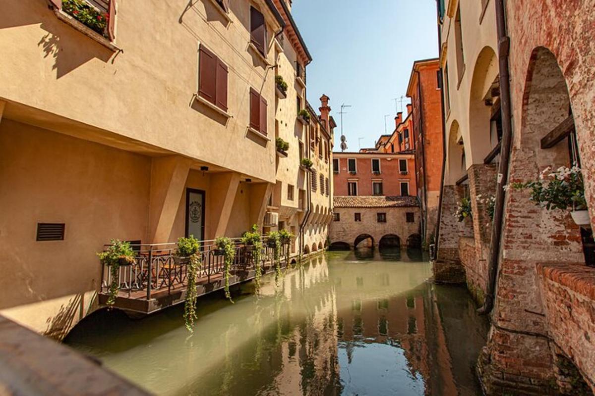 a canal in an alley between two buildings