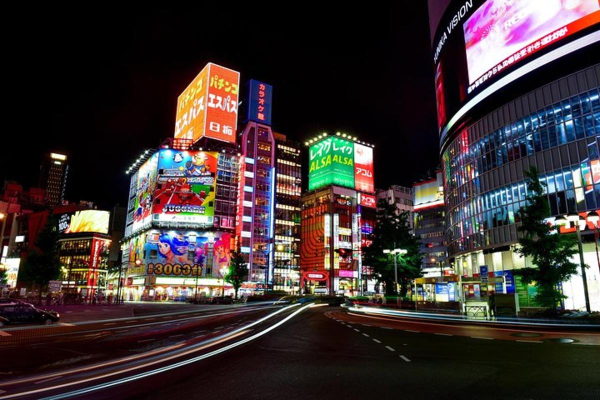 a city lit up at night with buildings