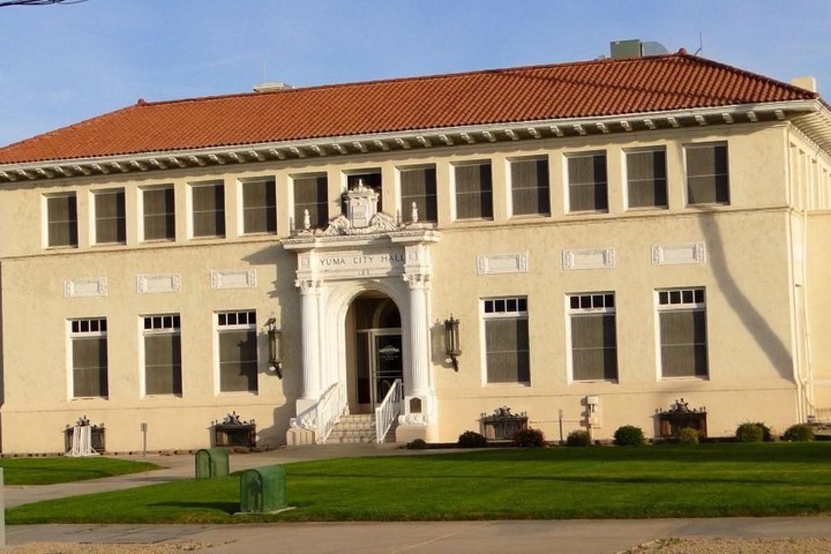 a large building with a statue in front of it