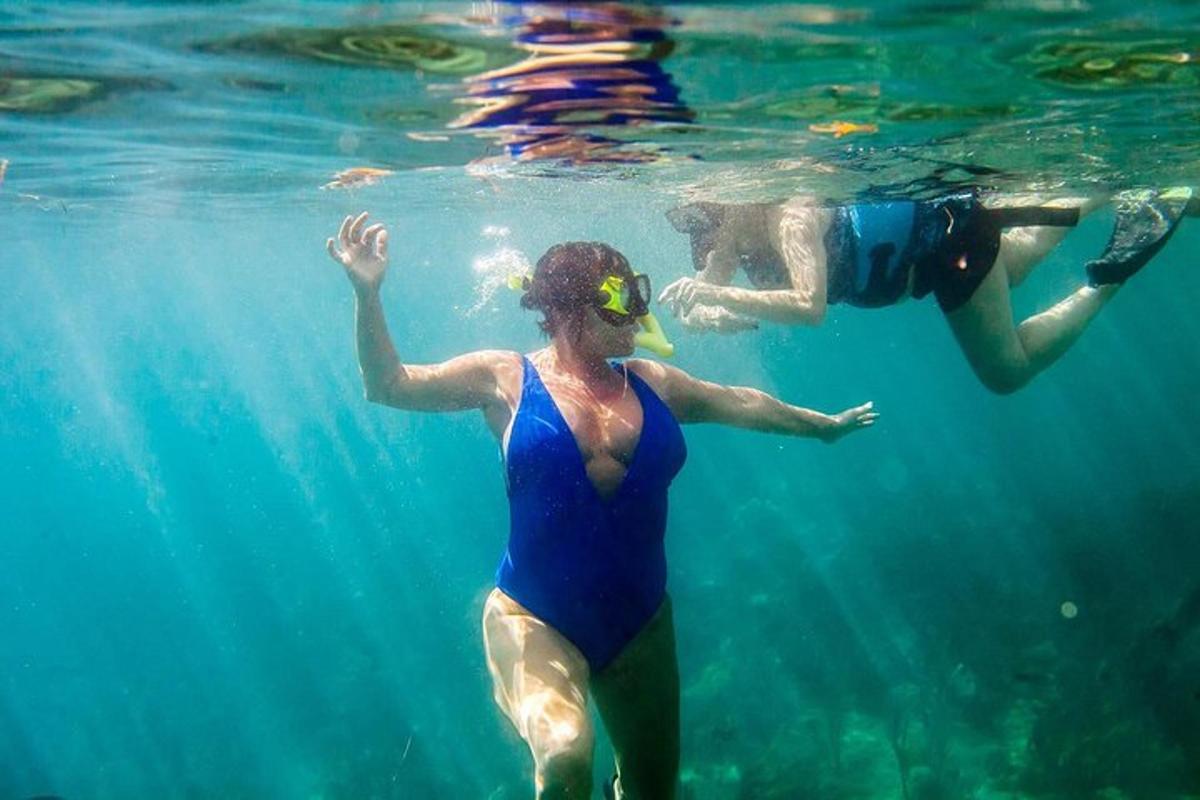 a man and a woman swimming in the water