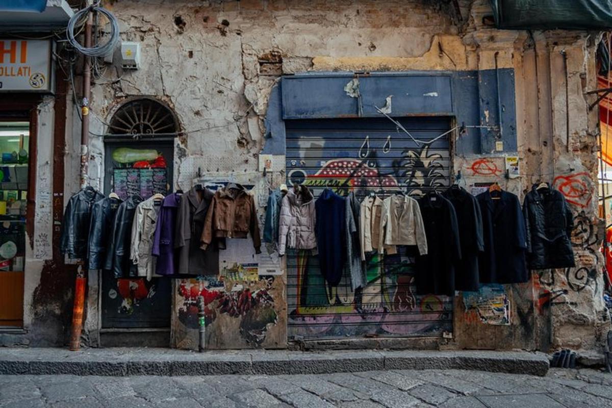 a store with a bunch of clothes hanging on a wall