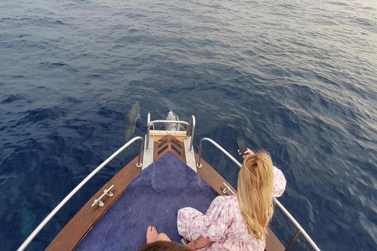 a couple of people on a boat in the water