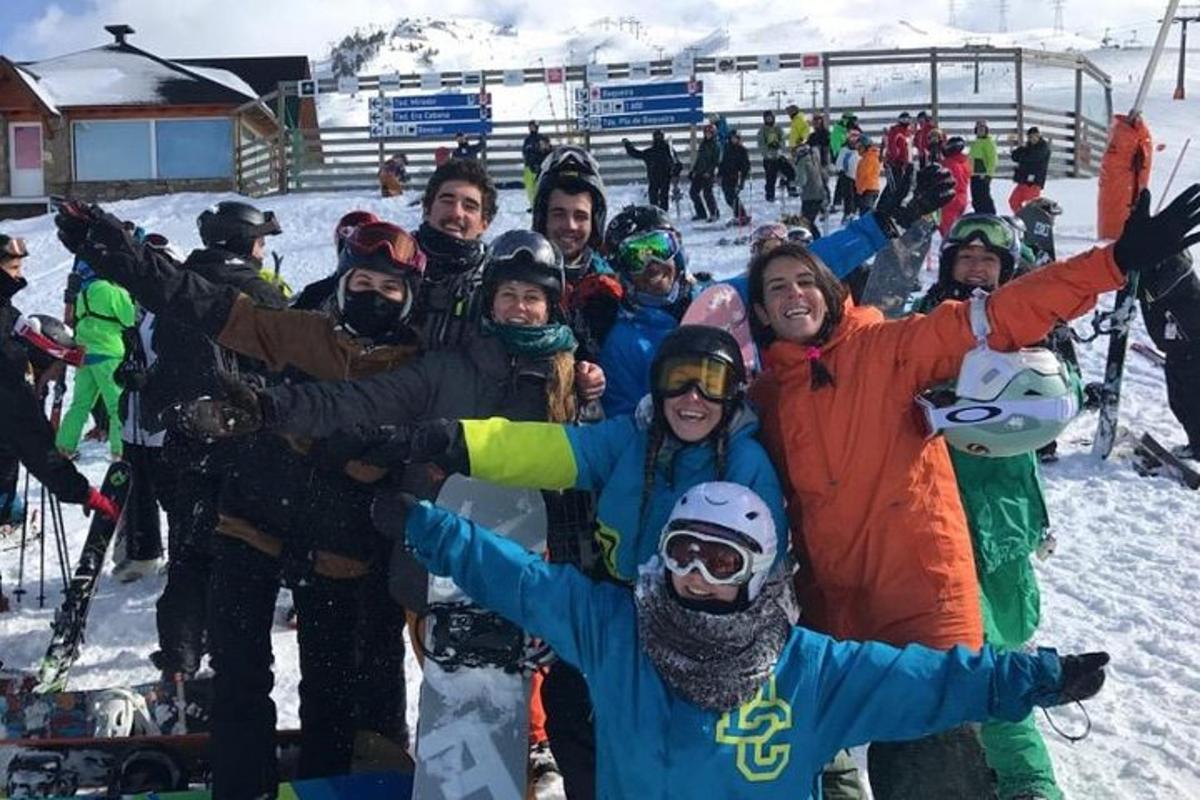 a group of people posing for a picture in the snow
