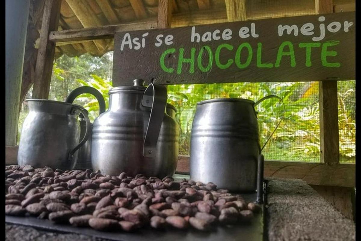 a group of three large metal pots and somenuts