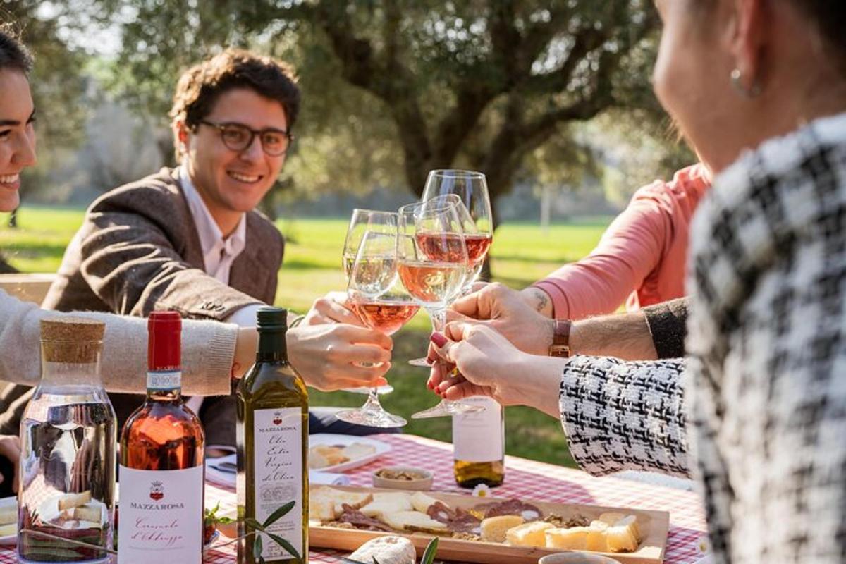 a group of people sitting around a table with wine glasses