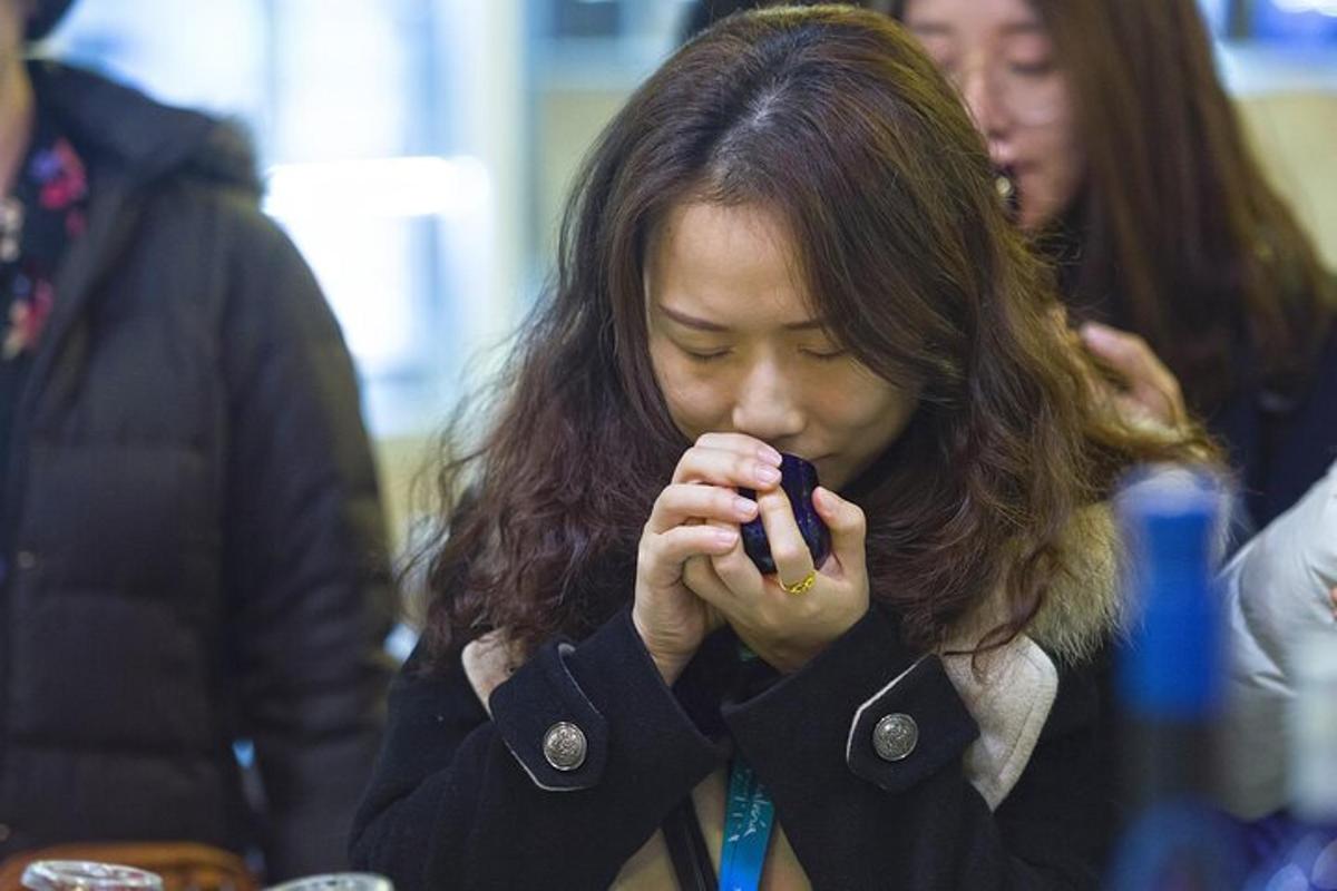 a woman is looking at her cell phone