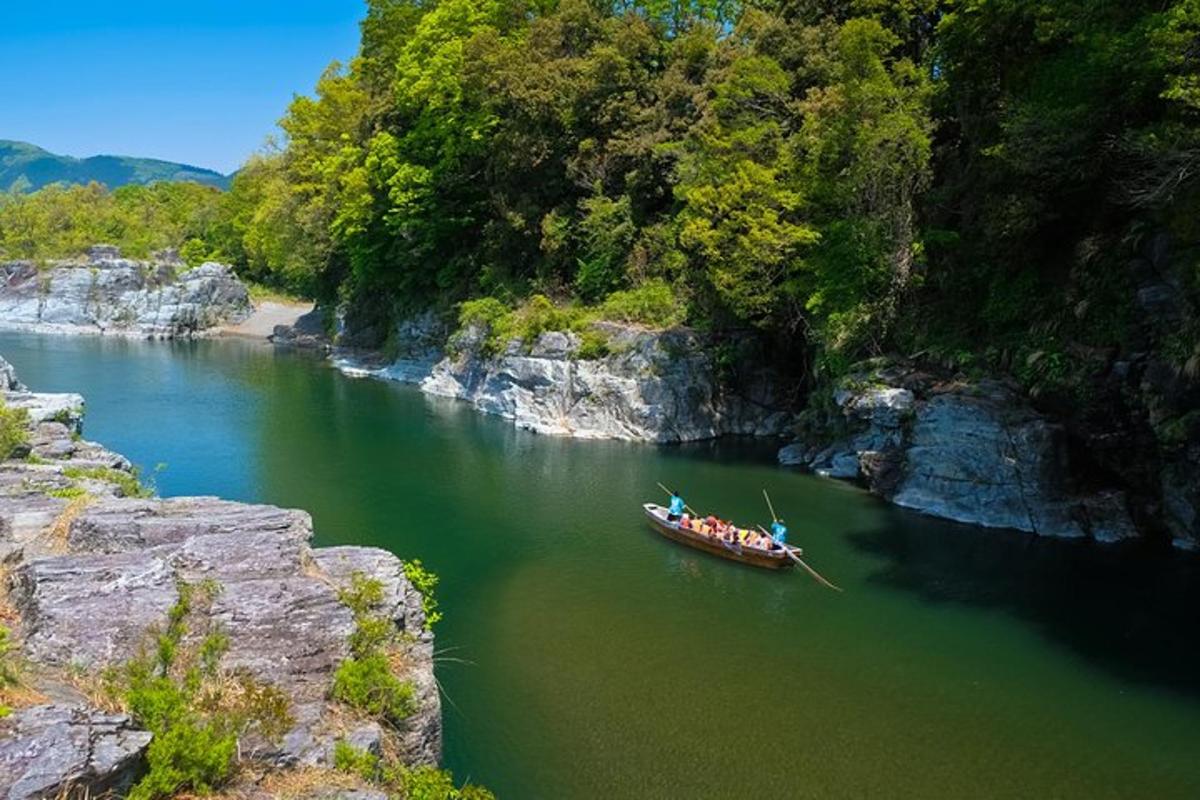 a group of people in a boat on a river