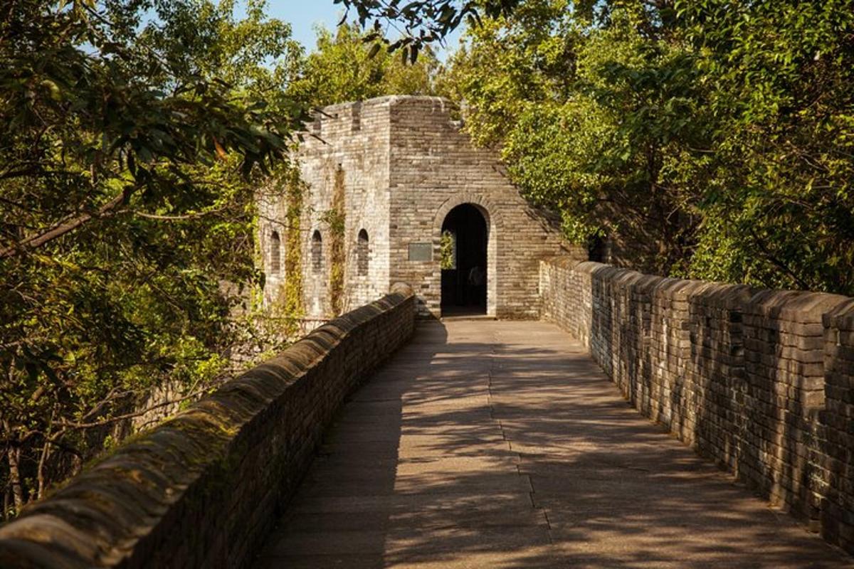 a brick bridge with a tunnel in the background