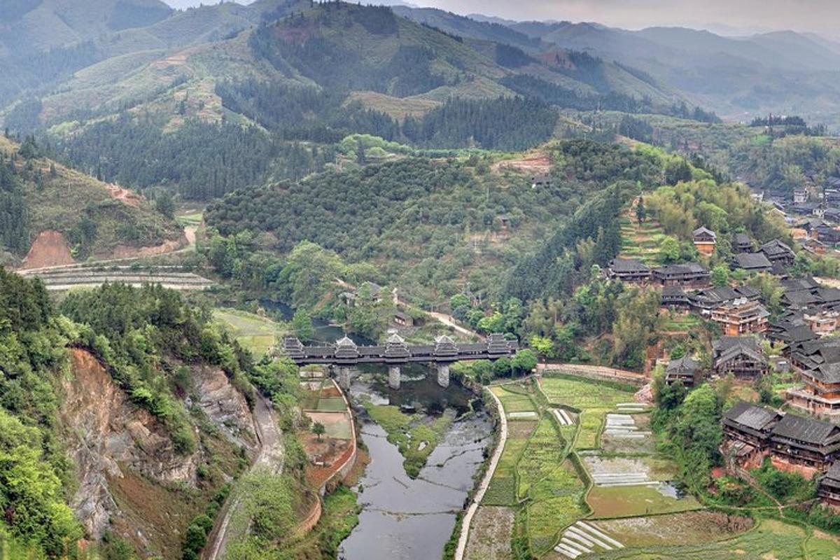 a train is crossing a bridge over a river